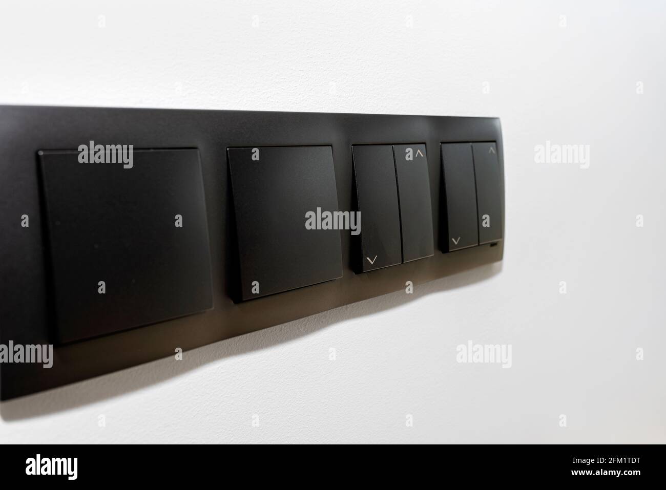 Black frame with a button to switch the lights and roller shutter up ...