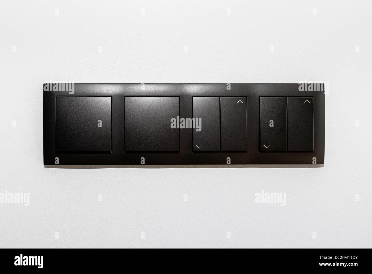 Black frame with a button to switch the lights and roller shutter up ...