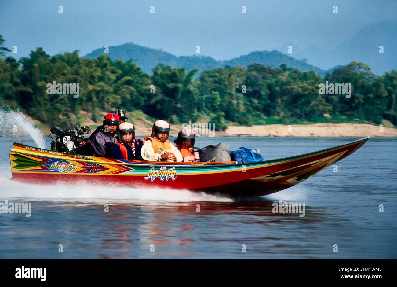 Who is in a hurry, or has enough money, travels by speedboat. Because of the high speed, helmets are mandatory. The fast travel, however, hits painful Stock Photo