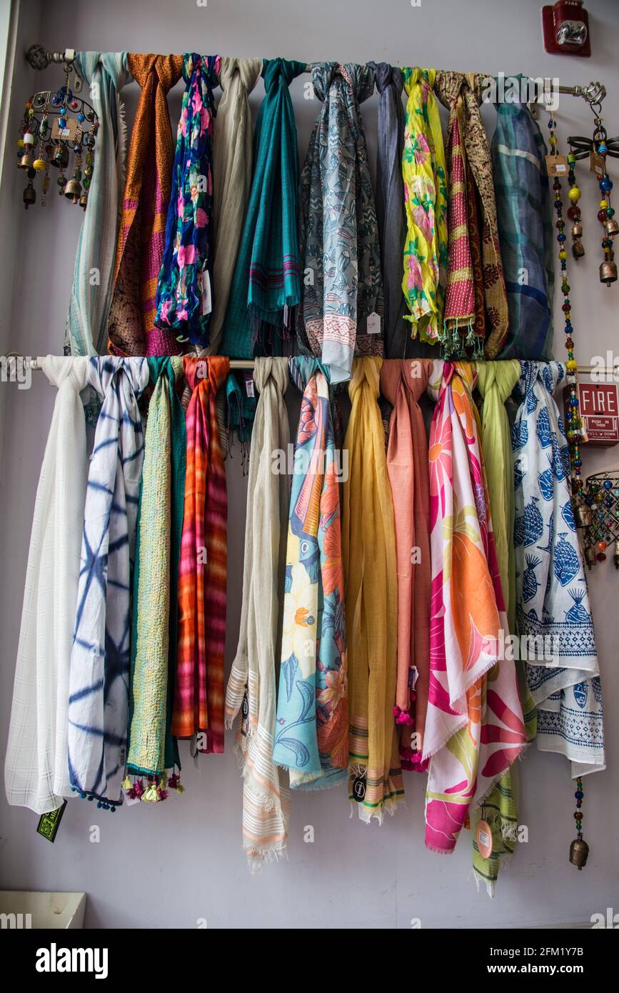 A rack of scarves on display in a store Stock Photo - Alamy
