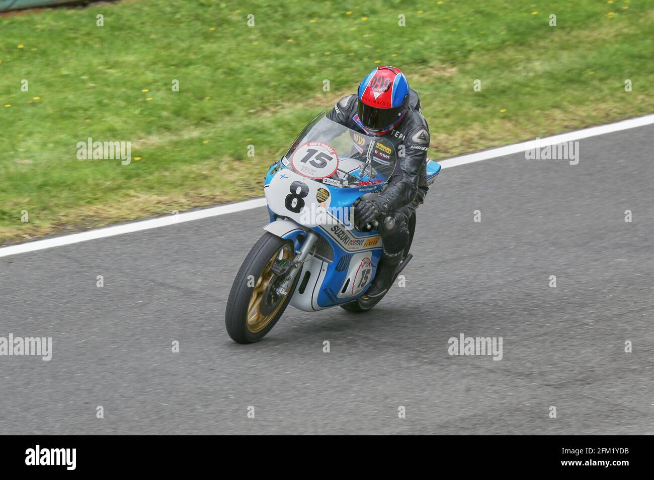 Teuvo Lansivuori approaches Coppice Corner on his Classic 3 Cylinder Suzuki 750 at the Cadwell Park International Classic in July 2015 Stock Photo