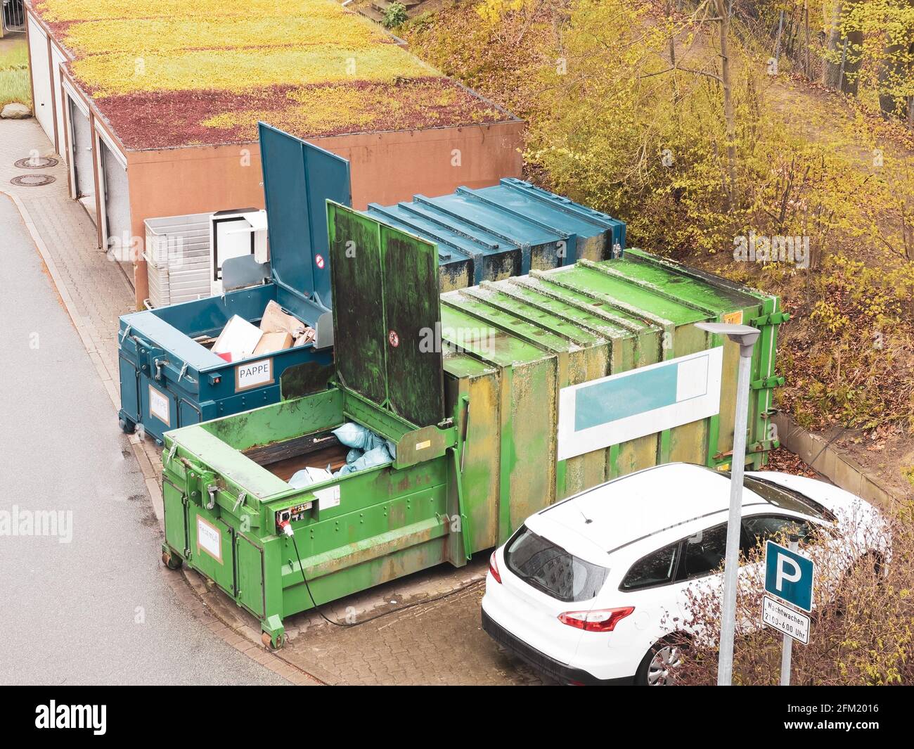 a trash compactor for cardboard and a trash compactor for residual
