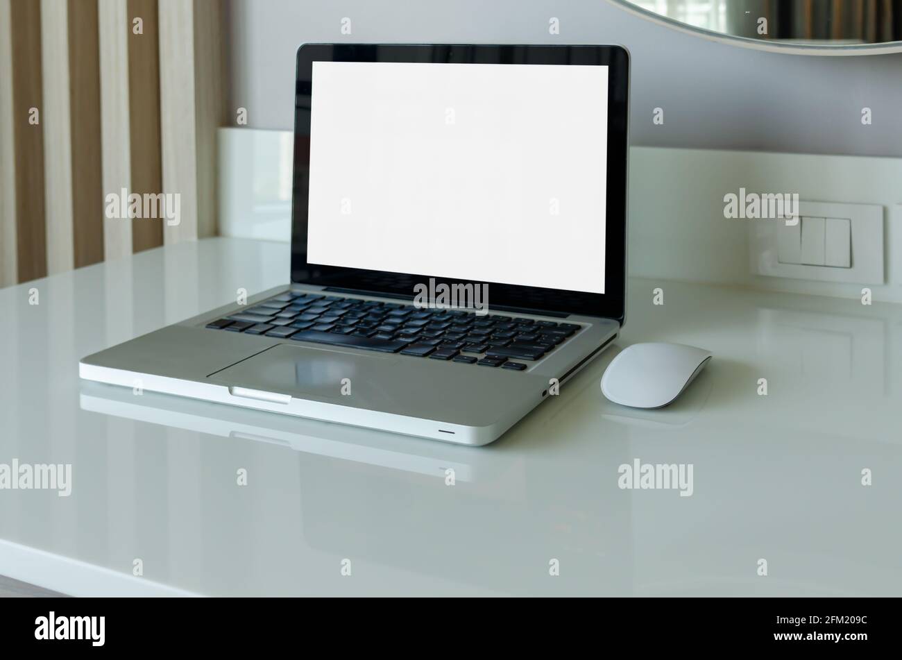 computer laptop mock up and mouse white blank screen on table. Stock Photo