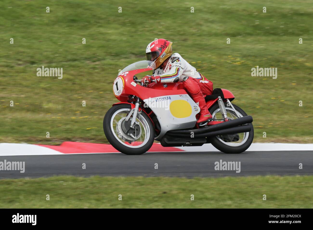 15 Times World Champion Giacomo Agostini aboard the 500cc 3 Cylinder MV Agusta at the Cadwell International Classic in July 2015 Stock Photo