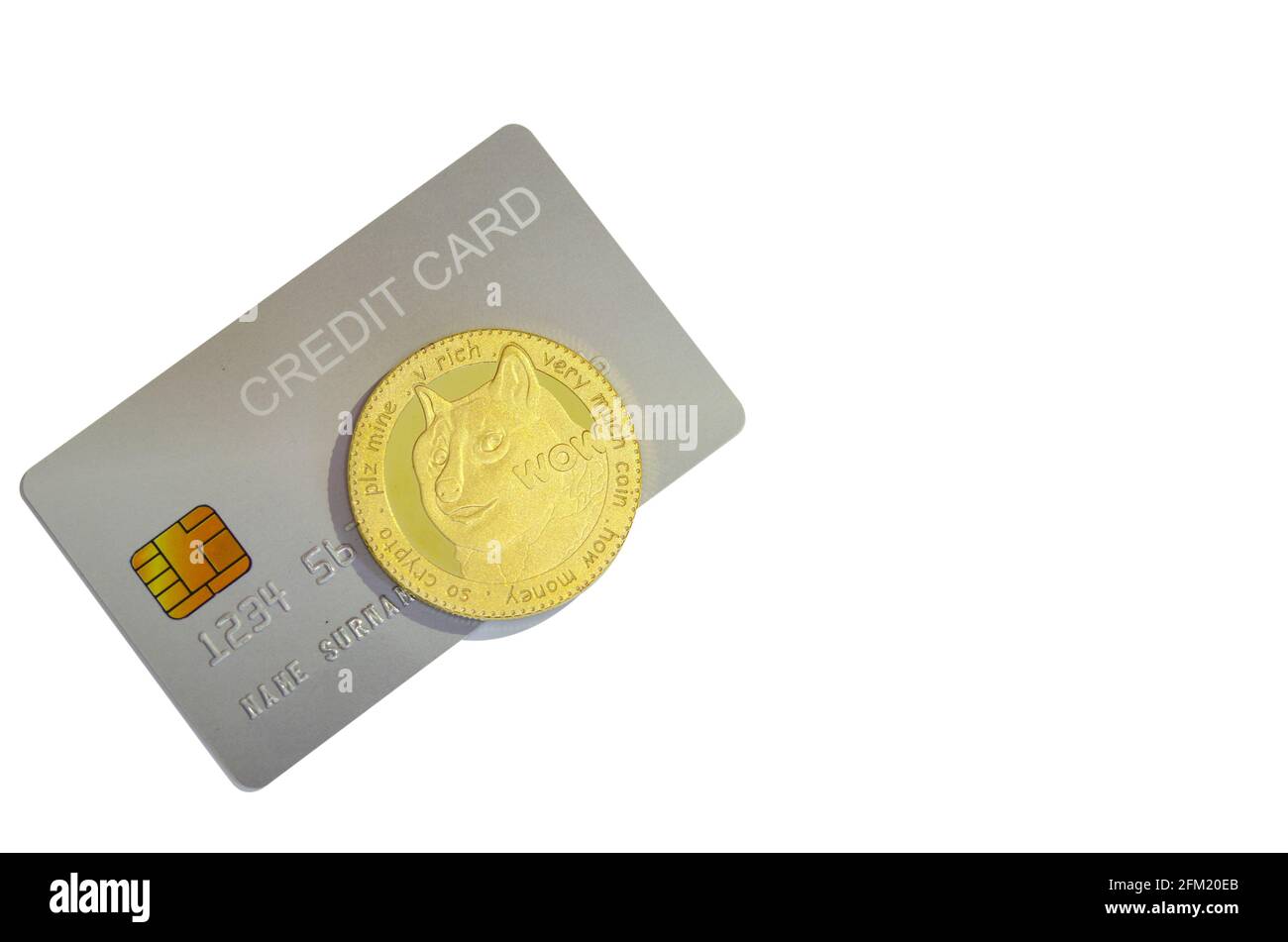 Dogecoin and credit cards isolated on white background. Stock Photo