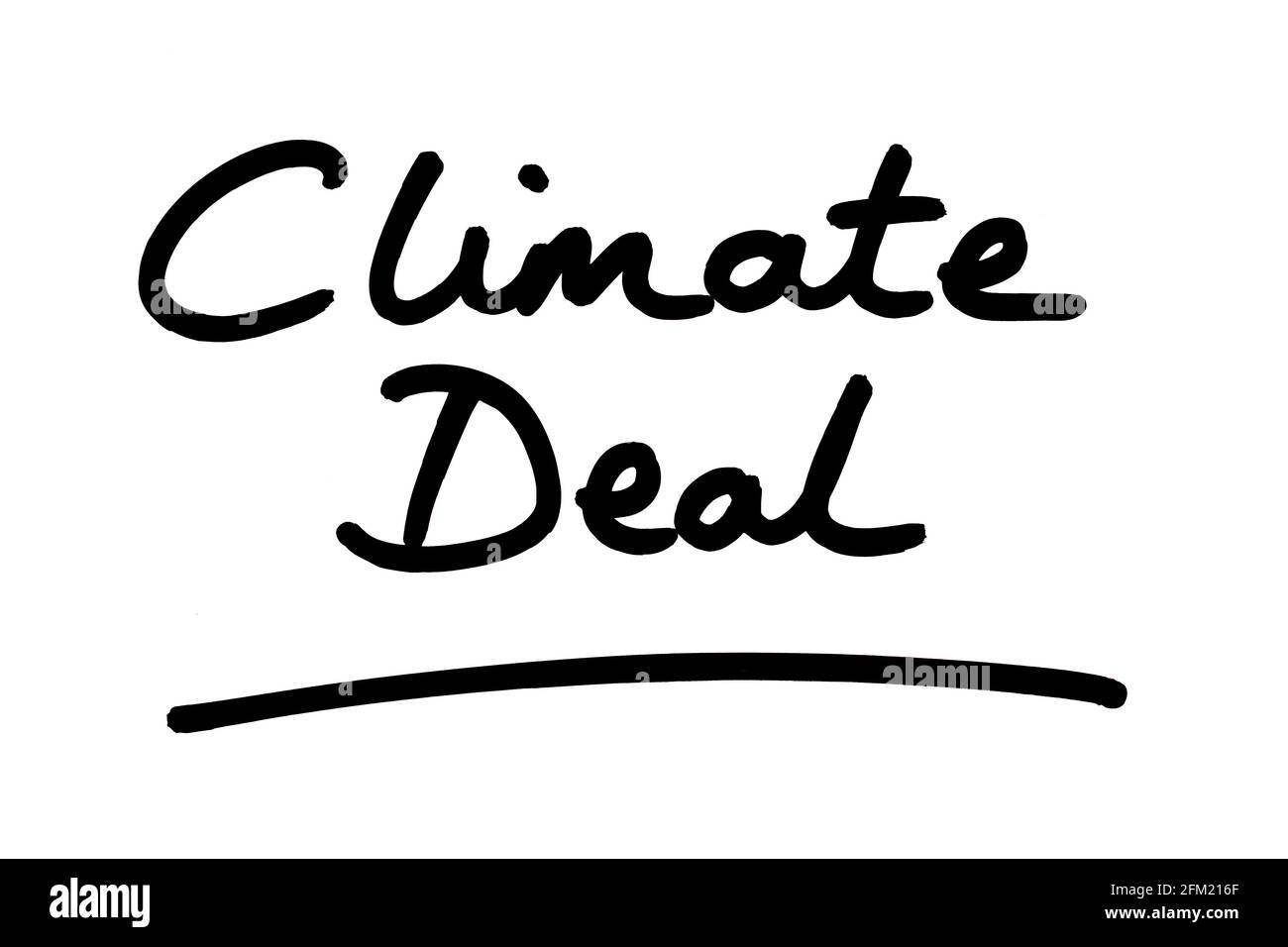 Climate Deal, handwritten on a white background. Stock Photo