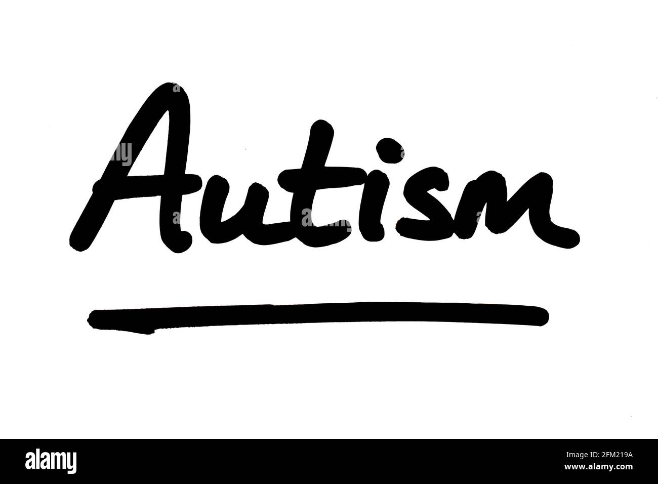 Autism, handwritten on a white background. Stock Photo