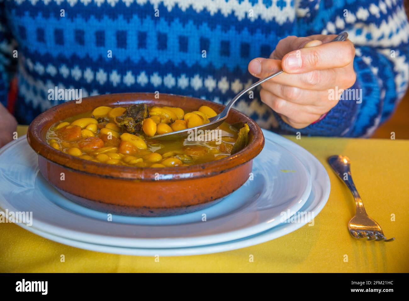 Eating beans stew. Spain. Stock Photo
