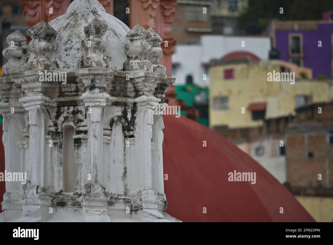 Baroque style Dome detail of the Templo de San Diego with Spanish Colonial houses in the background in Guanajuato, Mexico. Stock Photo
