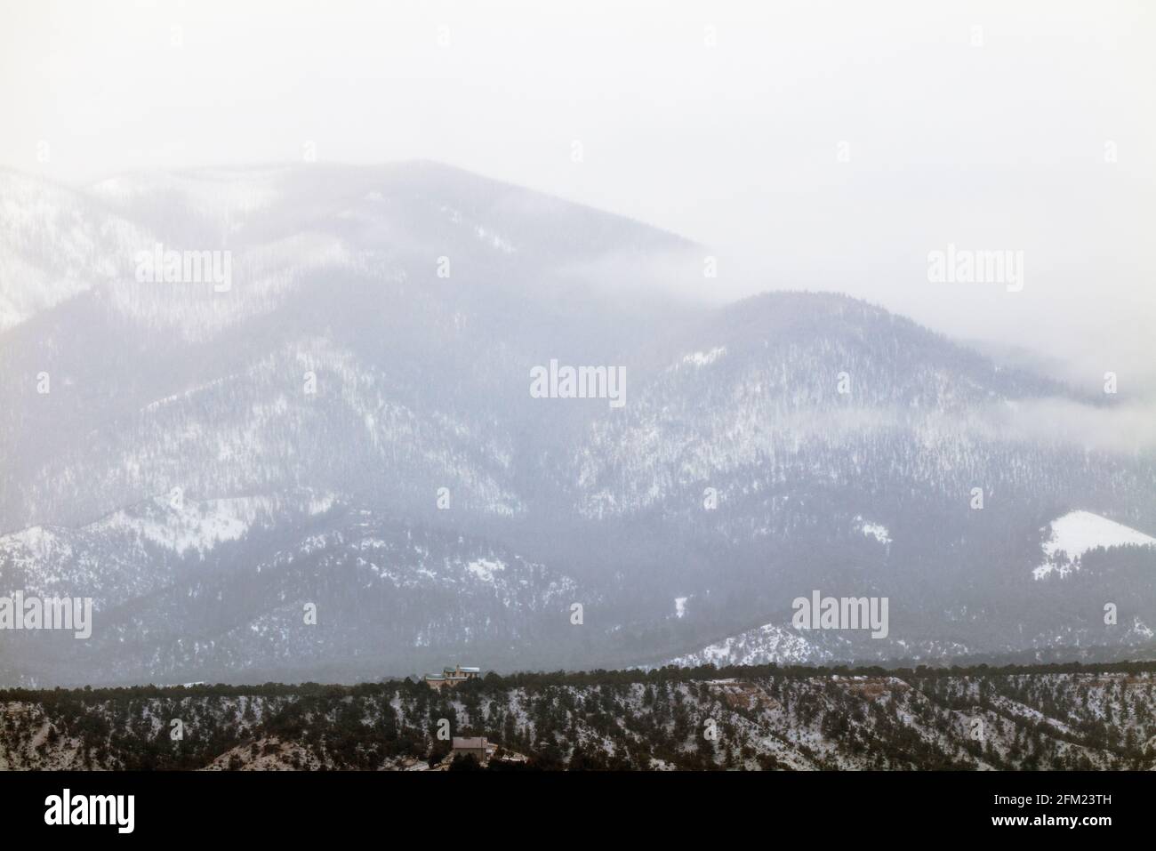 Cloudy winter view of snow covered Methodist Mountain; Sangre de Cristo Range; near Salida; Colorado; USA Stock Photo