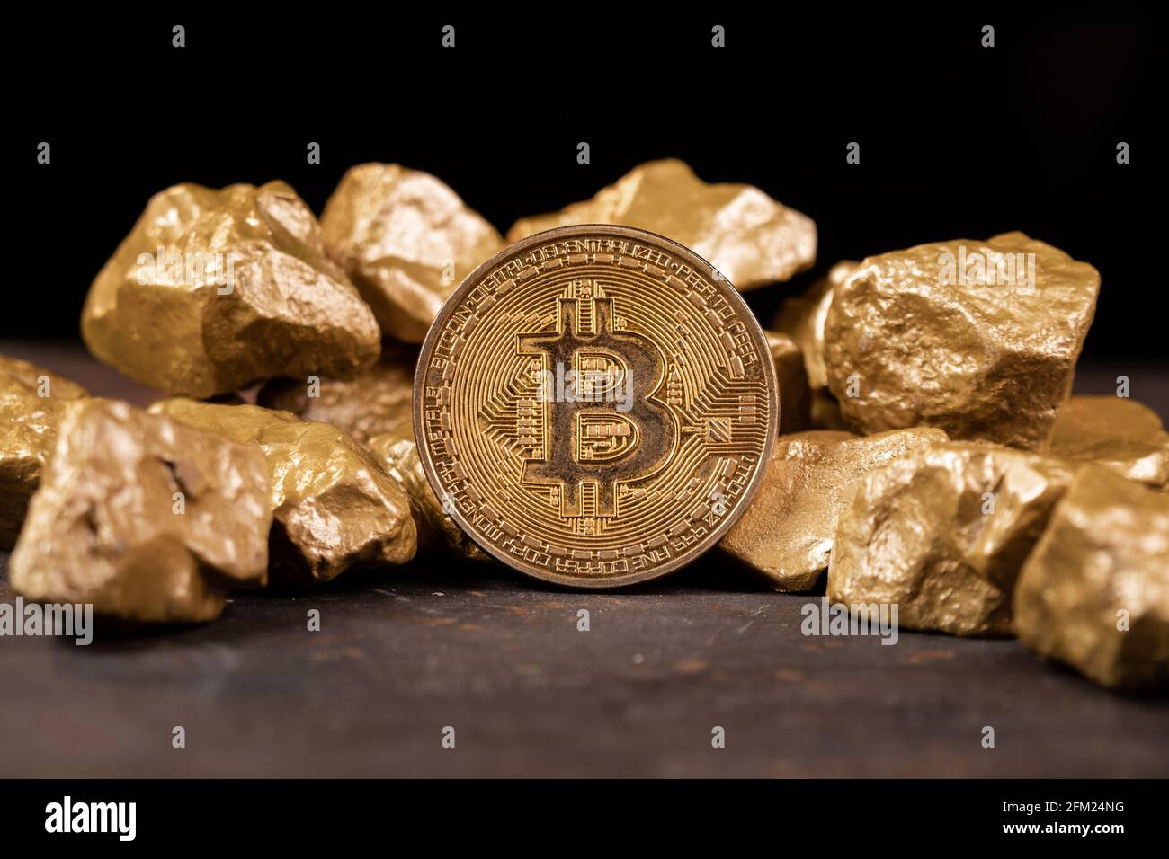 Bitcoin cryptocurrency with gold nuggets. Investment and store of value  concept Stock Photo - Alamy