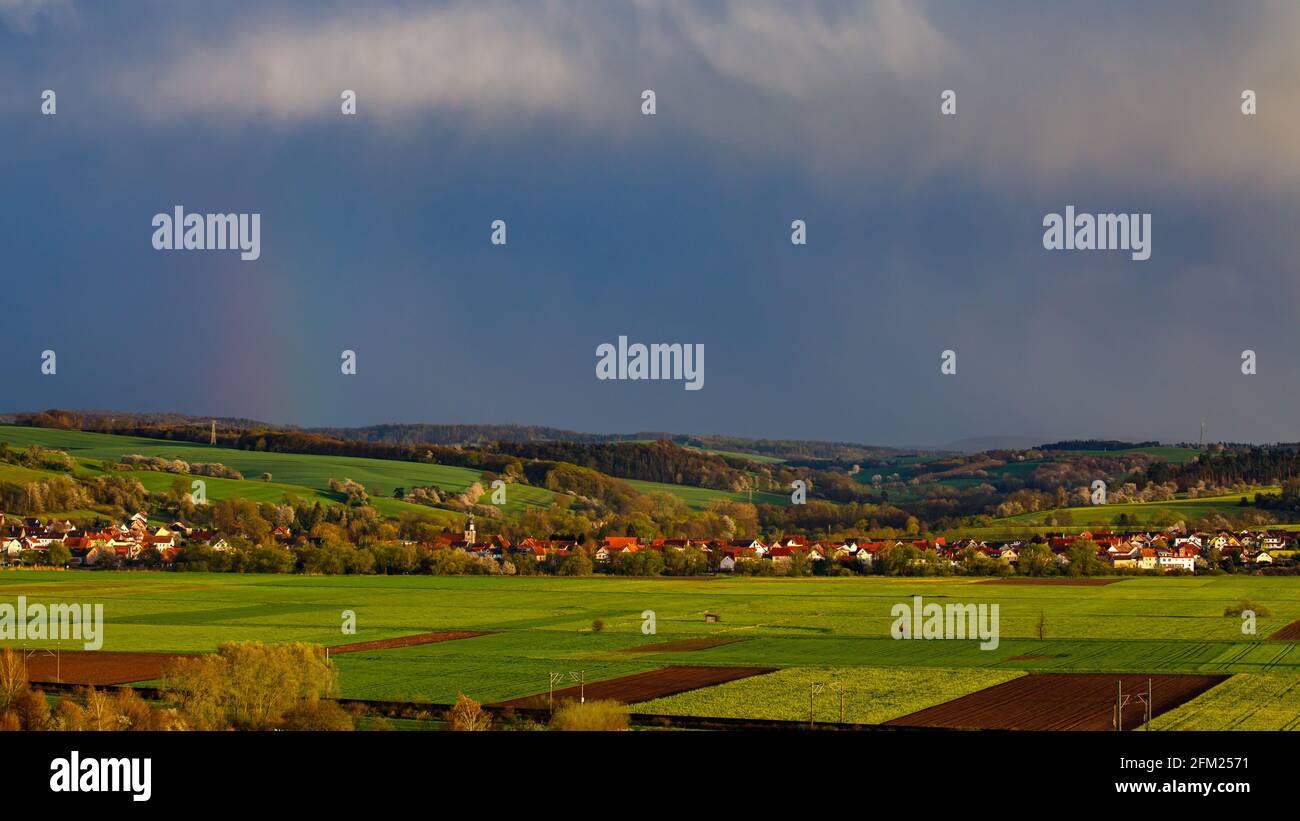 clouds and rain over the village of Lauchröden In Thuringia Stock Photo