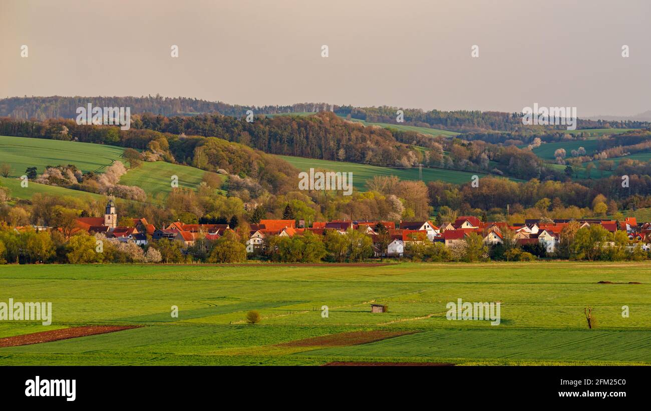 clouds and rain over the village of Lauchröden In Thuringia Stock Photo