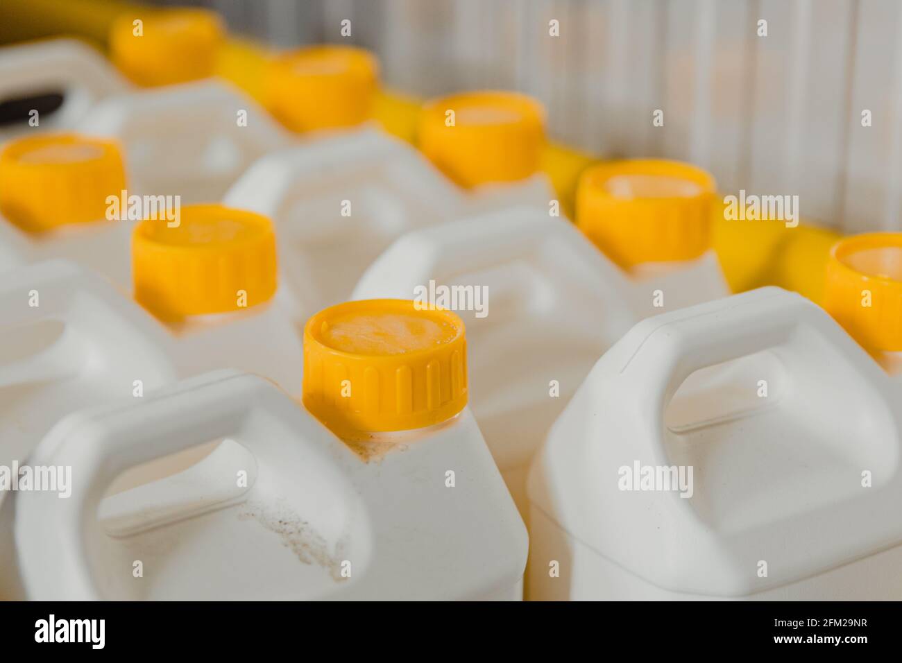 Plastic container cans for liquid chemical solutions Stock Photo - Alamy