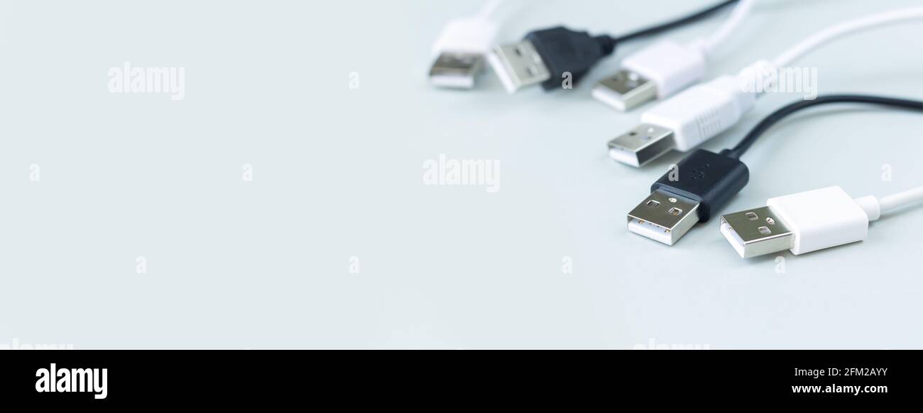 Different charging or data transmission plugs adapter from USB on gray background Stock Photo