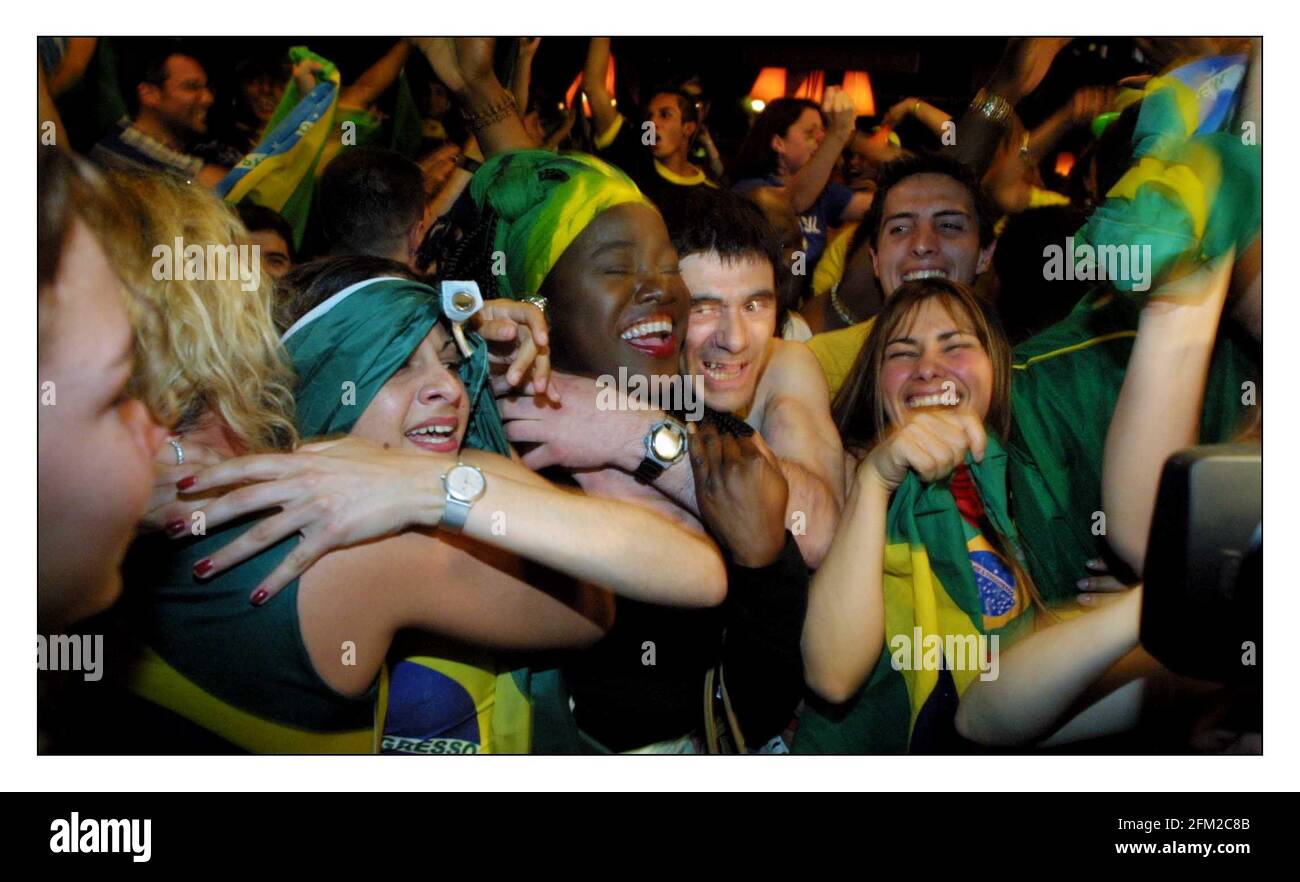 Brazil fans in Salsa Bar in London celebrate their win over England in
