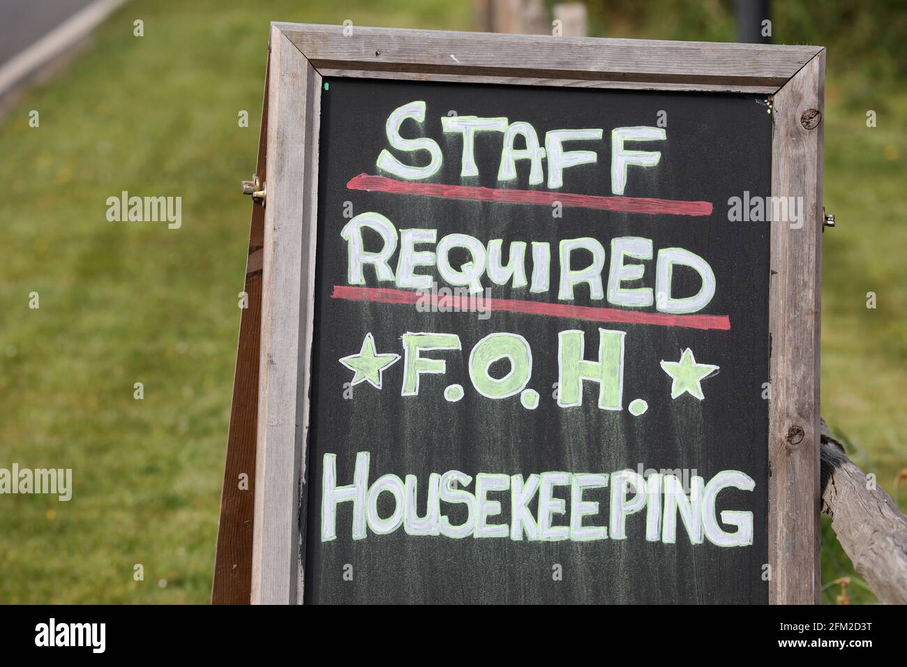 Staff required sign outside a pub in Sussex, UK. Stock Photo