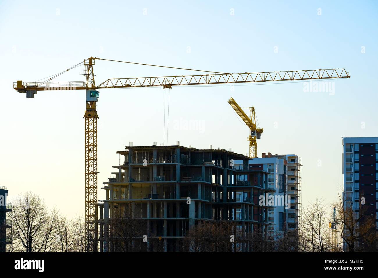 Aerial view of tower cranes and high residential apartment buildings ...