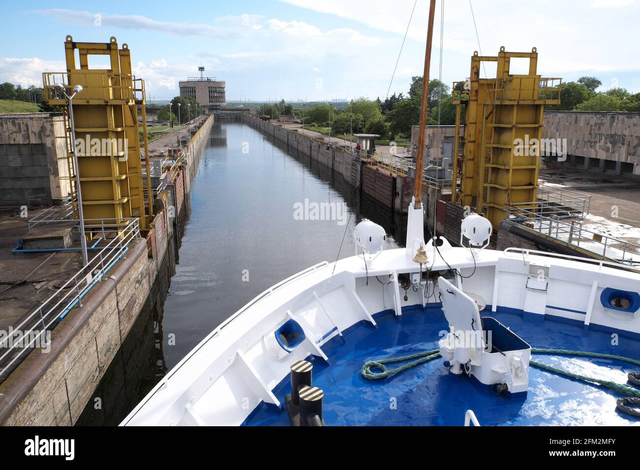 Cruise boat entering the lock, Dnieper Hydroelectric Station Dam, River Dnieper, Zaporozhye, Ukraine. Stock Photo