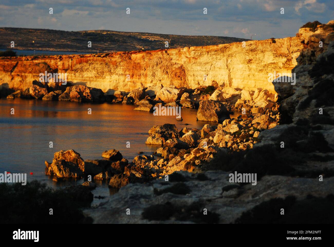 Paradise beach in Malta Island in sunset with the gold coast Stock Photo