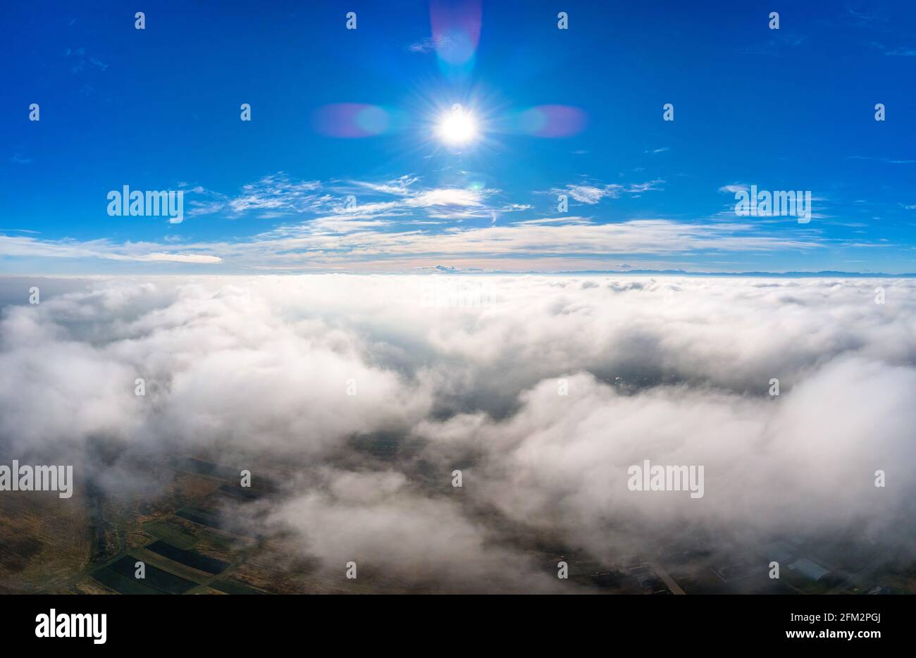 Aerial view from above of white puffy clouds in bright sunny day Stock ...