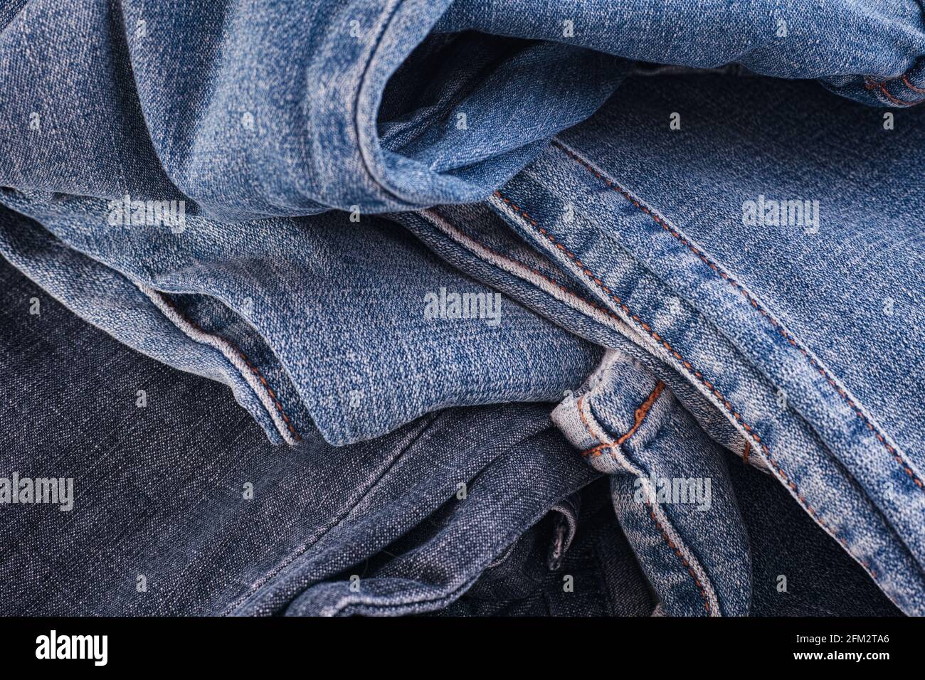 A crumpled denim jeans background. Close up. Stock Photo