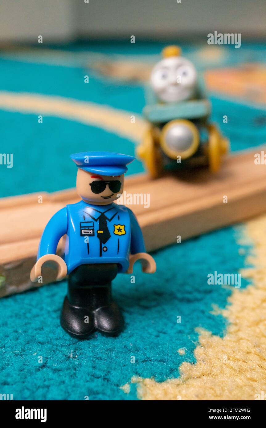 POZNAN, POLAND - May 03, 2021: Playtive police officer toy figurine by a  wooden train track Stock Photo - Alamy