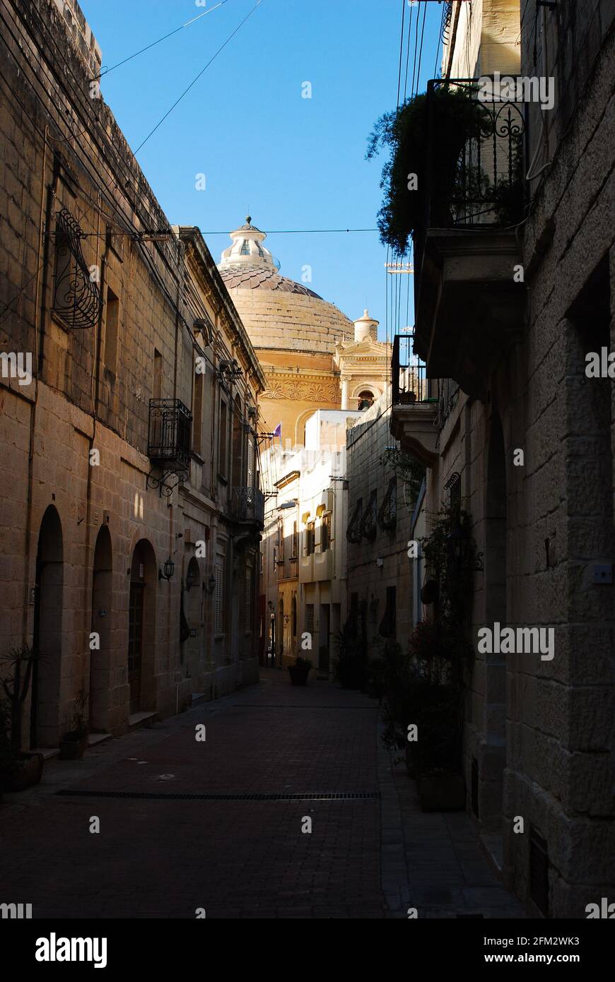 The street view on the famous Mosta Rotunda of Saint Maria Assunta in Maltese city Mosta Stock Photo