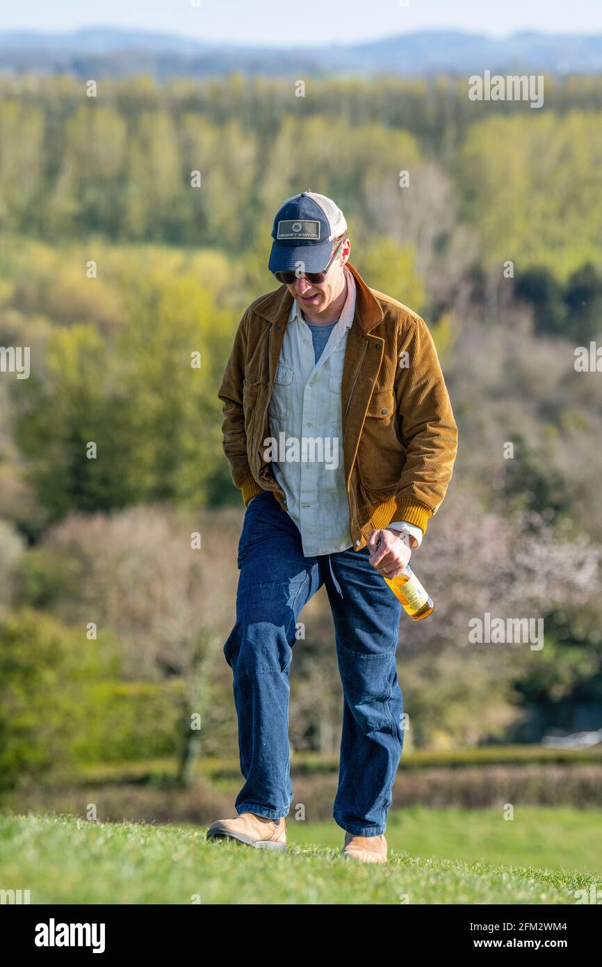 Actor Benedict Cumberbatch enjoys a bottle of cider on Burrow Hill in Somerset on Saturday evening after the final day of filming for Doctor Strange 2. Stock Photo