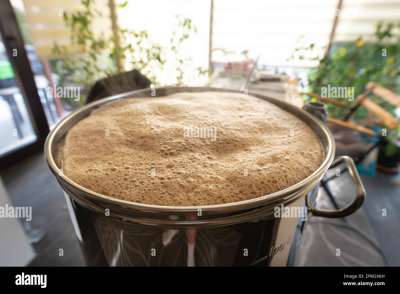 Most home brewers use brewing machines to brew beer at home. Stock Photo