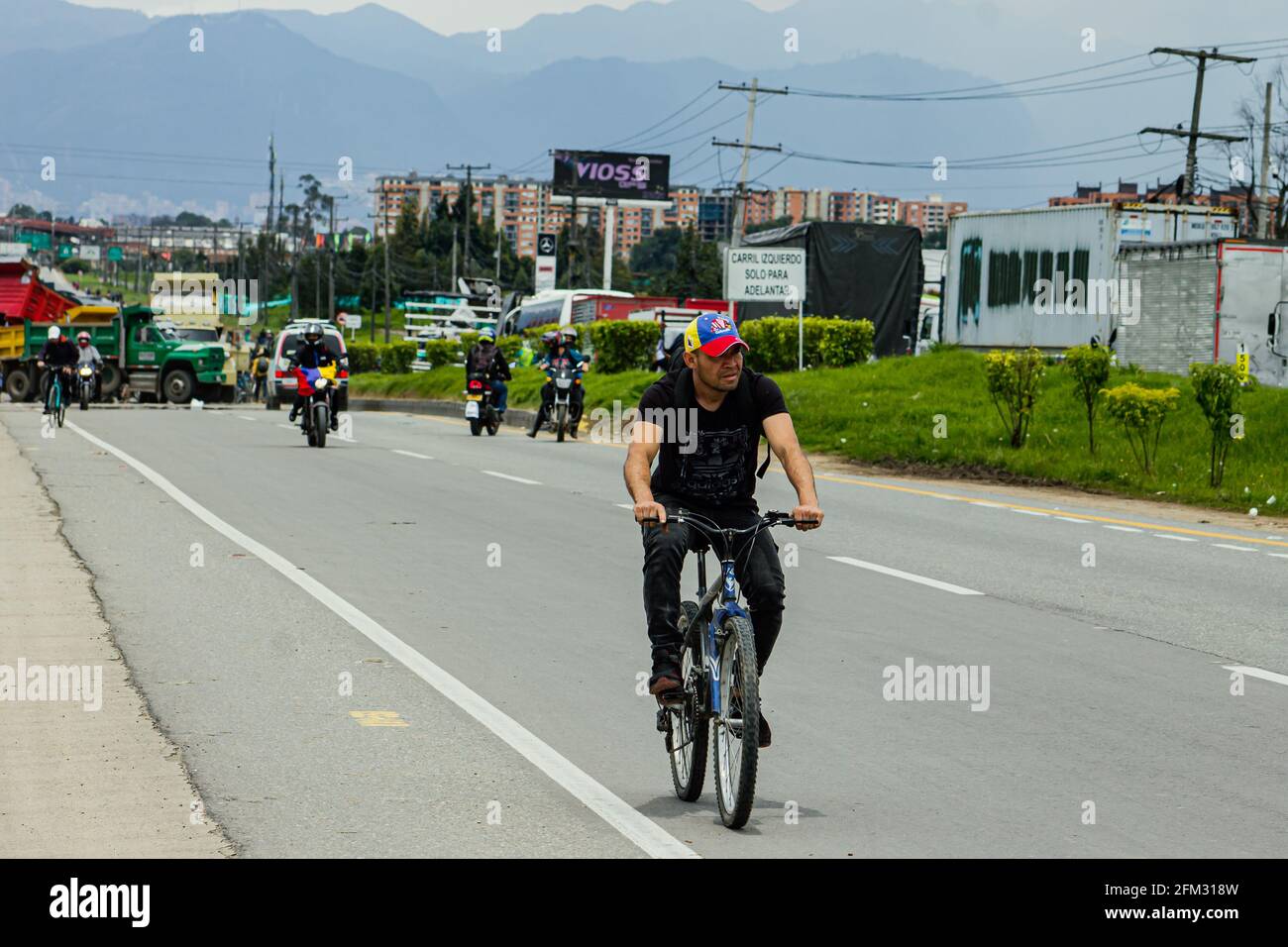 People mobilize by bicycle due to the blocking of trucks on the Medellín highway, Calle 80 in Bogotá and Cundinamarca for a protest against the Govern Stock Photo