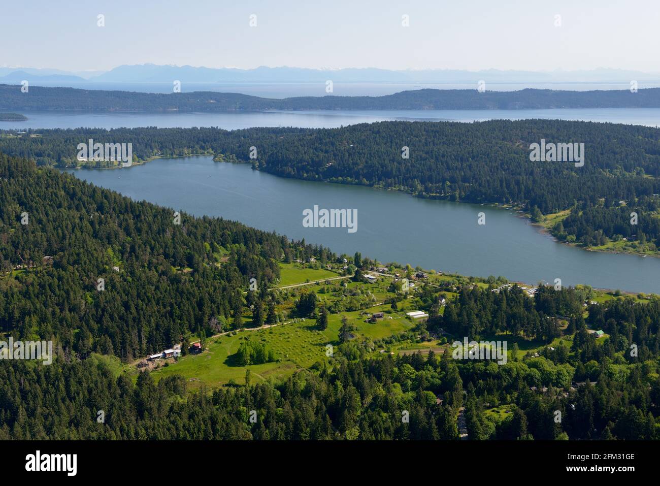 Saint Mary's Lake with Trincomali Channel and the Gulf Islands in the background, Salt Spring Island, British Columbia, Canada Stock Photo