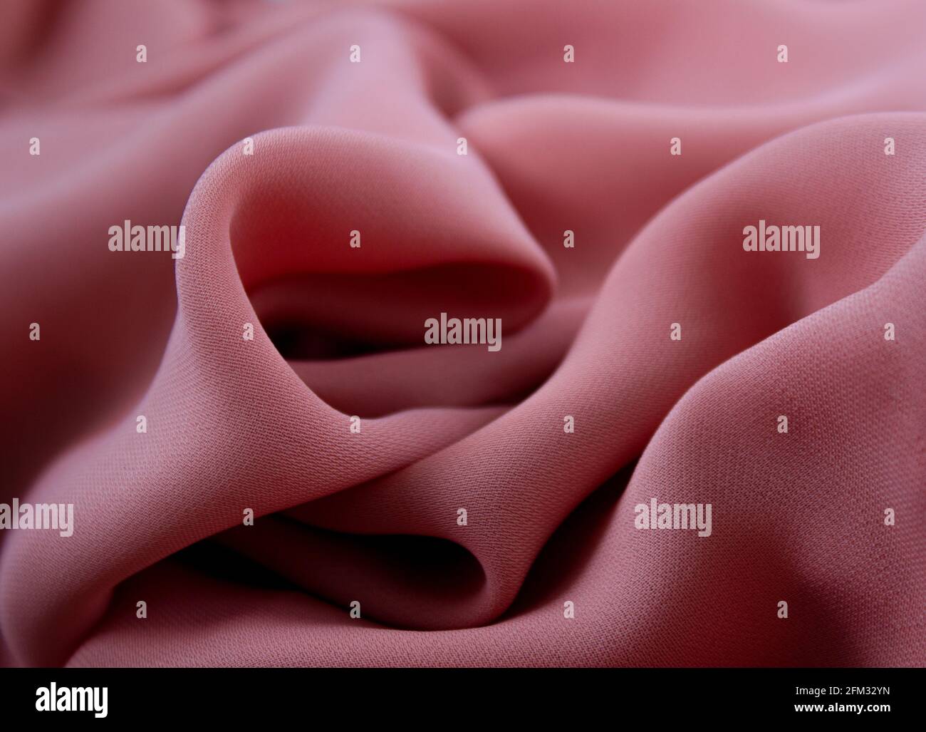 Closeup texture of pink fabric or cloth in pink color. Fabric texture