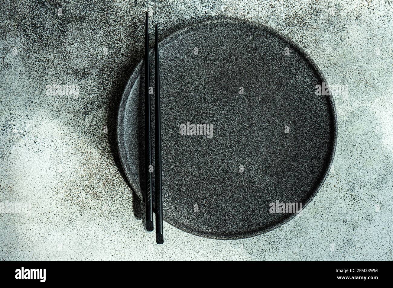 Overhead view of a modern minimalistic Asian place setting on a table Stock Photo