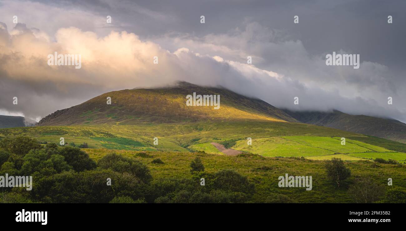 Beautiful sunrise, sunlight illuminating mountain and cloud on it ...