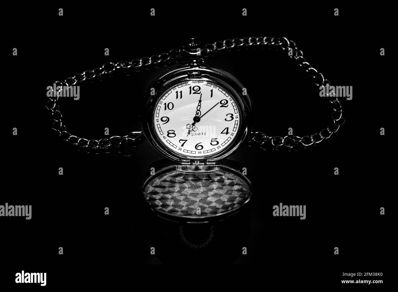 Closeup shot of an oldstyle pocket watch with a chain Stock Photo Alamy