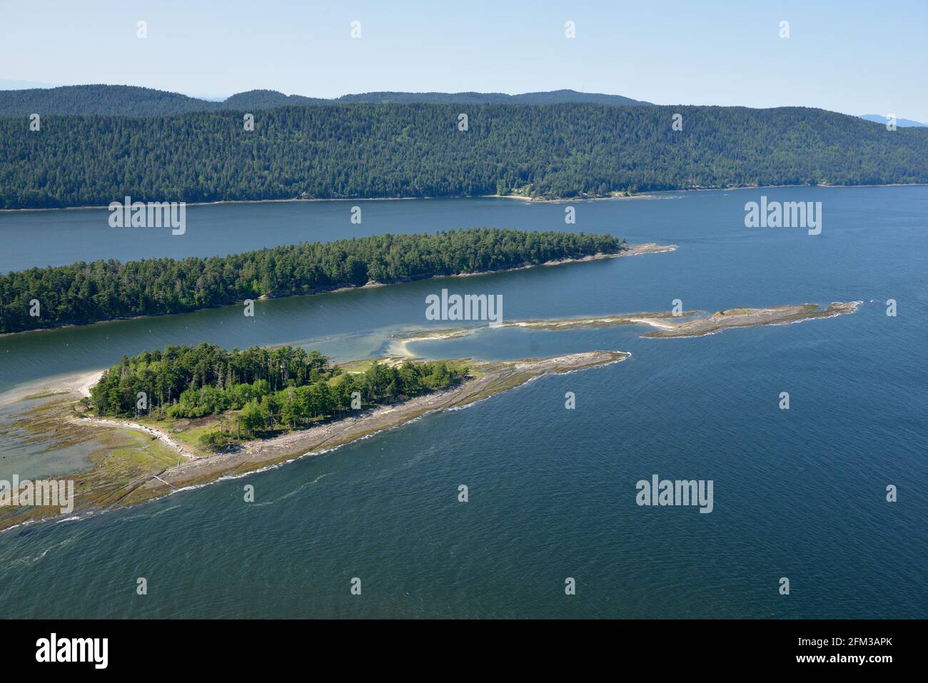 Aerial photo of Cabbage Island with Saturna Island in the background