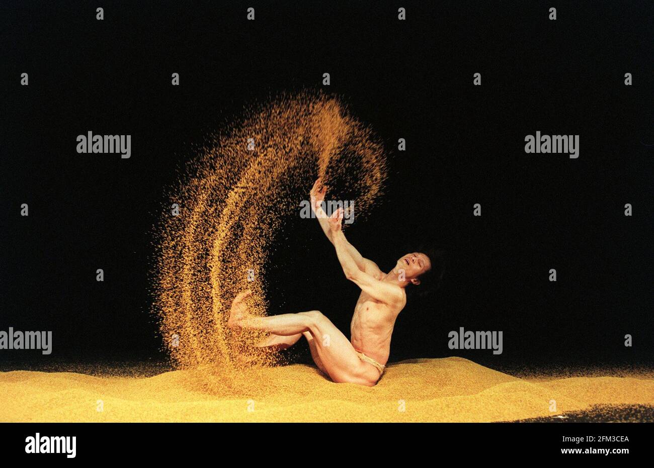 The Cloud Gate Dance Theatre Company April 1999Wu I-fang one of the dancers from Taiwan's Cloud Gate Dance Theatre The show which opens at the sadlers wells  uses three tons of rice pic by andrew buurman Stock Photo