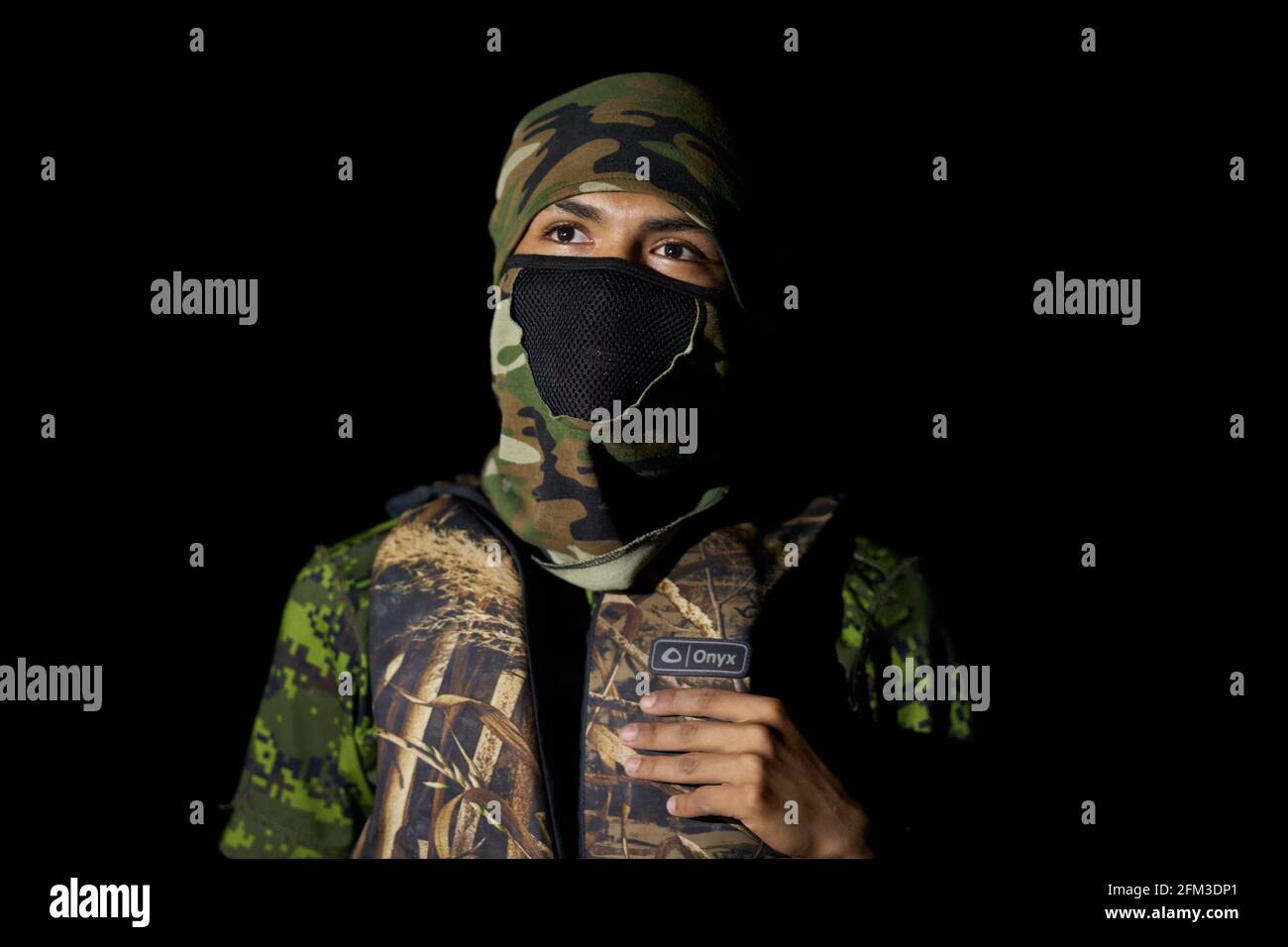 Roma, Texas, USA. 3rd May, 2021. A 17 year old smuggler sits on his