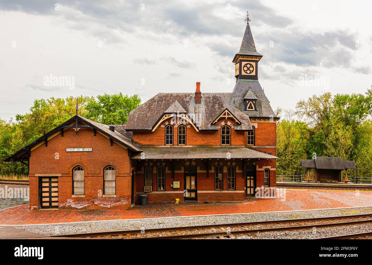 Point of Rocks is a small town on the border of Virginia and Maryland, with historic buildings. Footage shows historic brick railway station build in Stock Photo