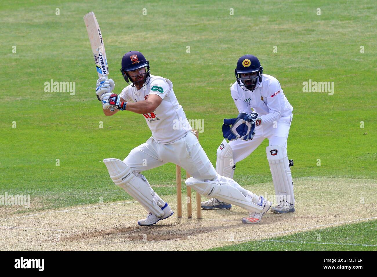 Jaik Mickleburgh in batting action for Essex as Dinesh Chandimal of Sri Lanka looks on from behind the stumps during Essex CCC vs Sri Lanka, Tourist M Stock Photo