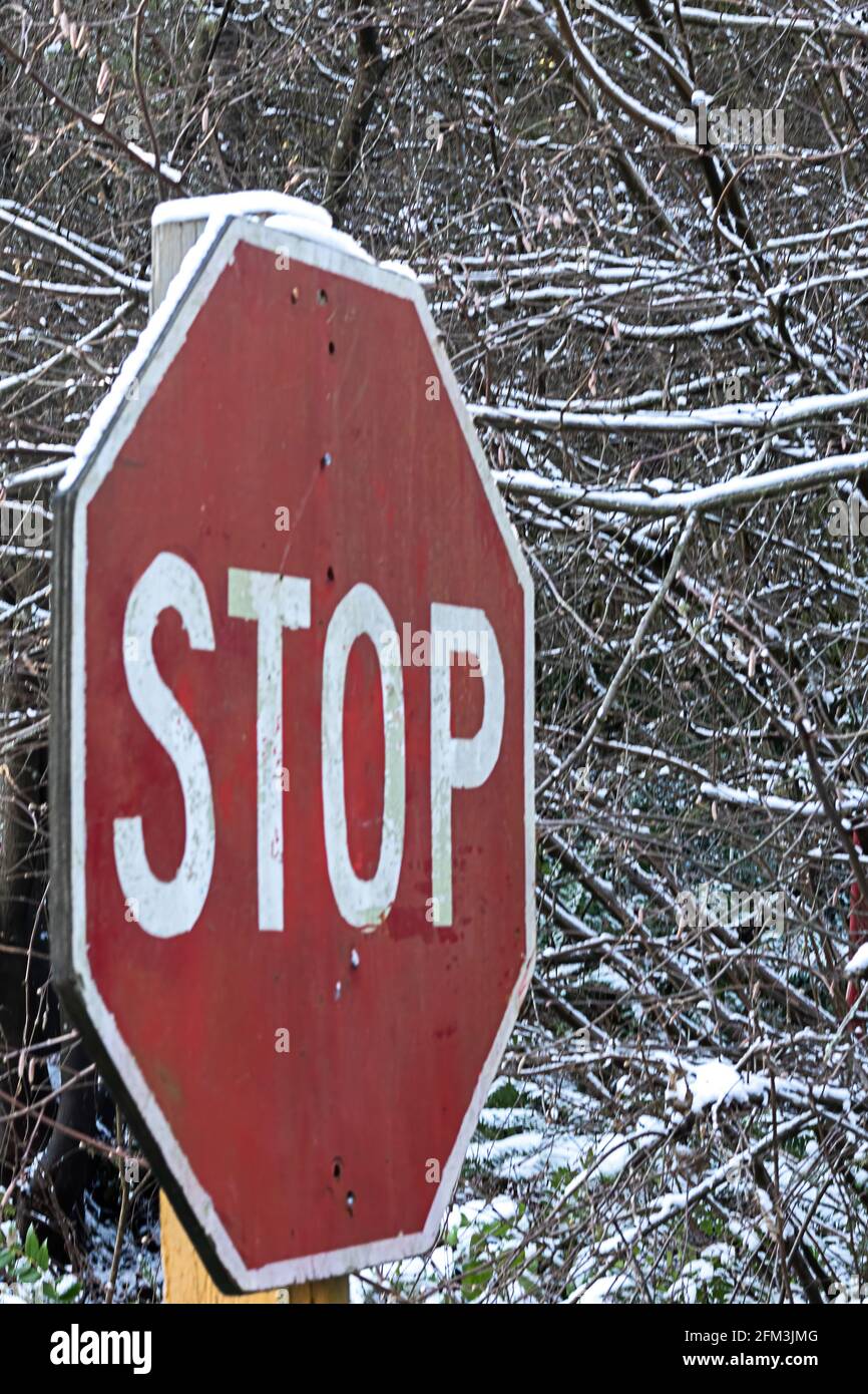 Stop sign in rural area covered in snow Stock Photo - Alamy