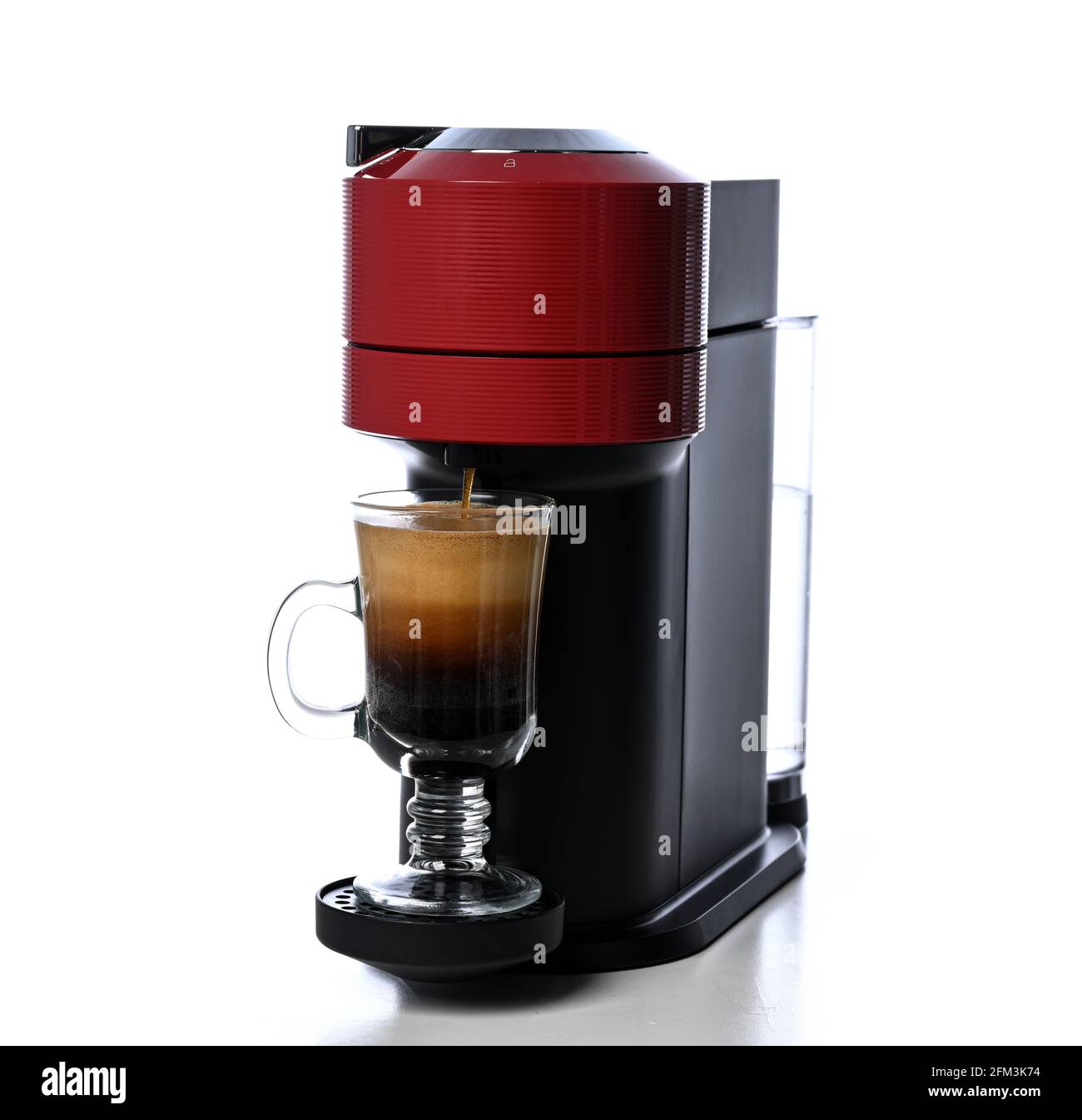 Red Espresso coffee machine making hot coffee with capsules and water
