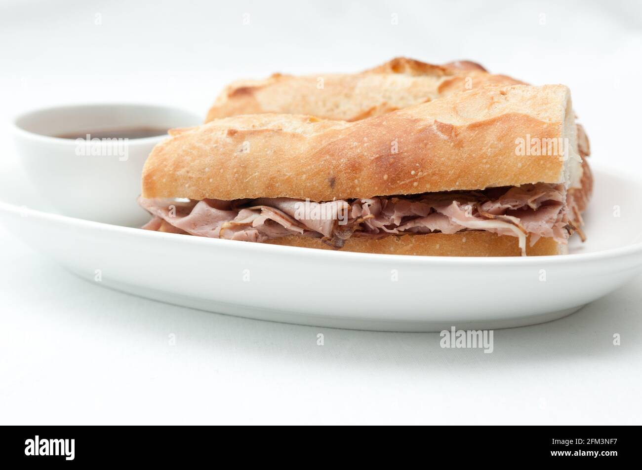 french beef dip sandwich au jus Stock Photo Alamy
