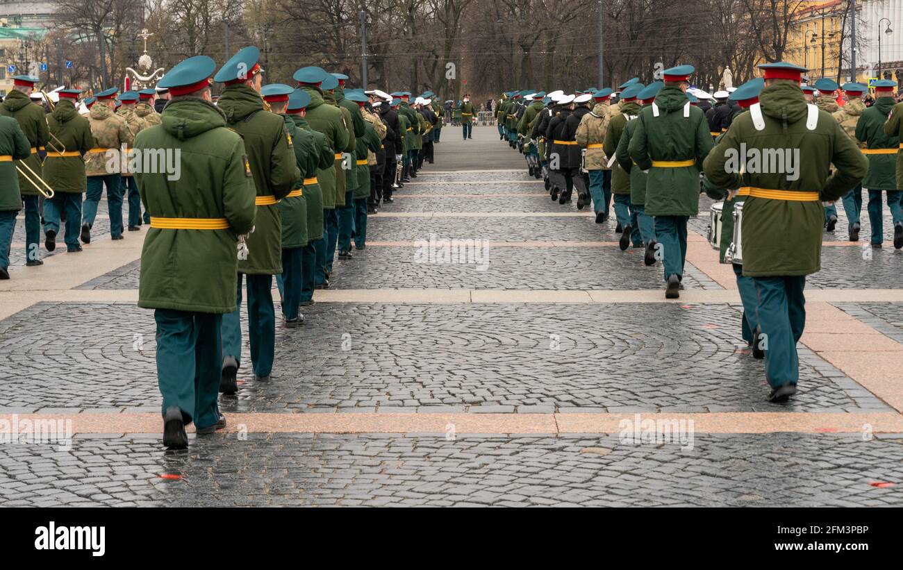 Military brass band members are marching in rows during the events for the 76th Victory Day, back view, in St Petersburg, Russia Stock Photo