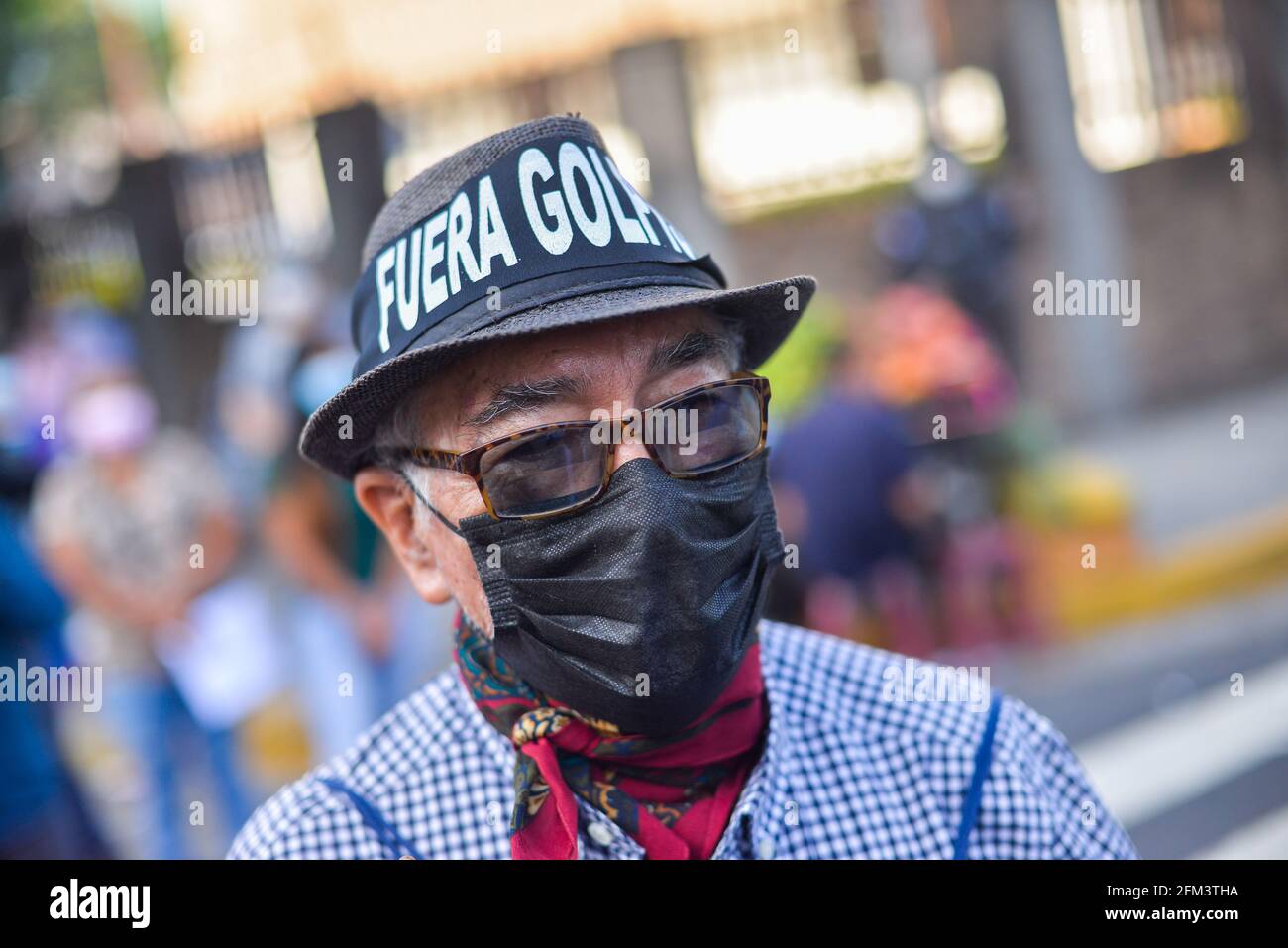 San Salvador, El Salvador. 05th May, 2021. A protestor wears a headband against the legislative coup during the demonstration. Protesters protest outside of the Supreme Justice Court against the legislative coup performed by President Bukele's party in Congress where the Constitutional Tribunal and Attorney General where ousted. (Photo by Camilo Freedman/SOPA Images/Sipa USA) Credit: Sipa USA/Alamy Live News Stock Photo