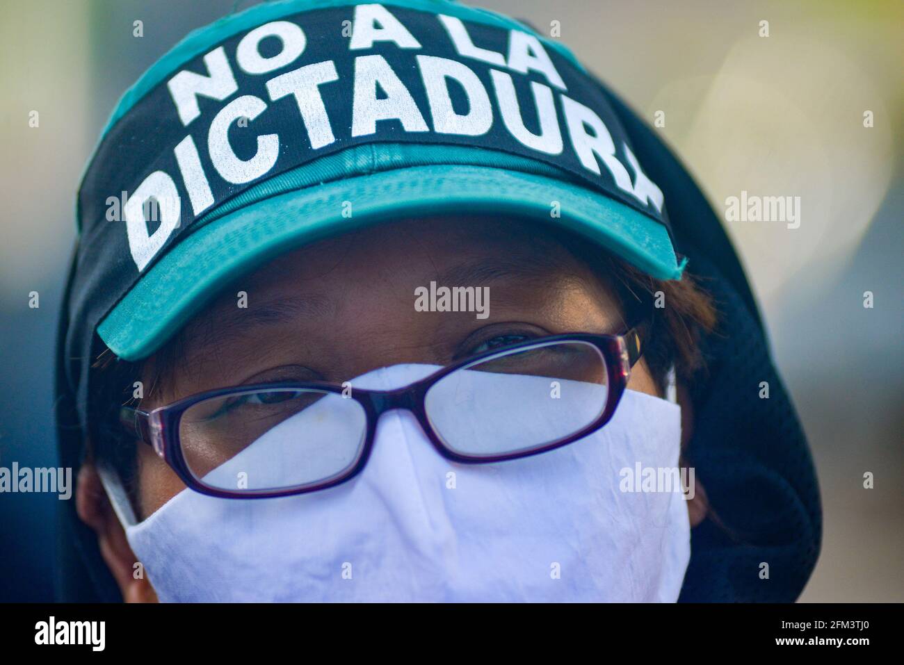 San Salvador, El Salvador. 05th May, 2021. A protestor wearing a headband against the legislative coup during the demonstration. Protesters protest outside of the Supreme Justice Court against the legislative coup performed by President Bukele's party in Congress where the Constitutional Tribunal and Attorney General where ousted. (Photo by Camilo Freedman/SOPA Images/Sipa USA) Credit: Sipa USA/Alamy Live News Stock Photo