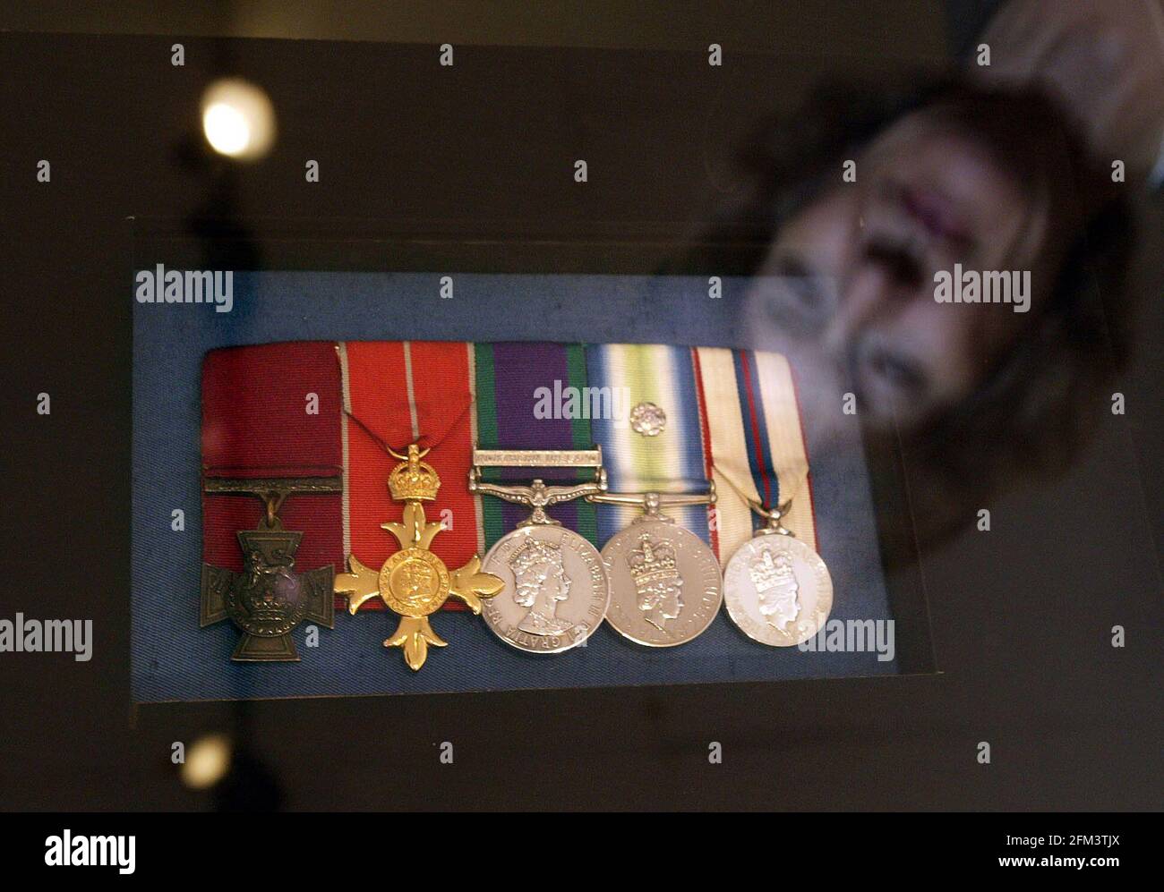 A new exhibition marking the 25th anniversary of the Falklands War includes the Victoria Cross awarded to H Jones. his wife Sara Jones (reflected in glass case) was at the National Army Museum to view the exhibition which runs from 2April to September 2007.  pic David Sandison Stock Photo