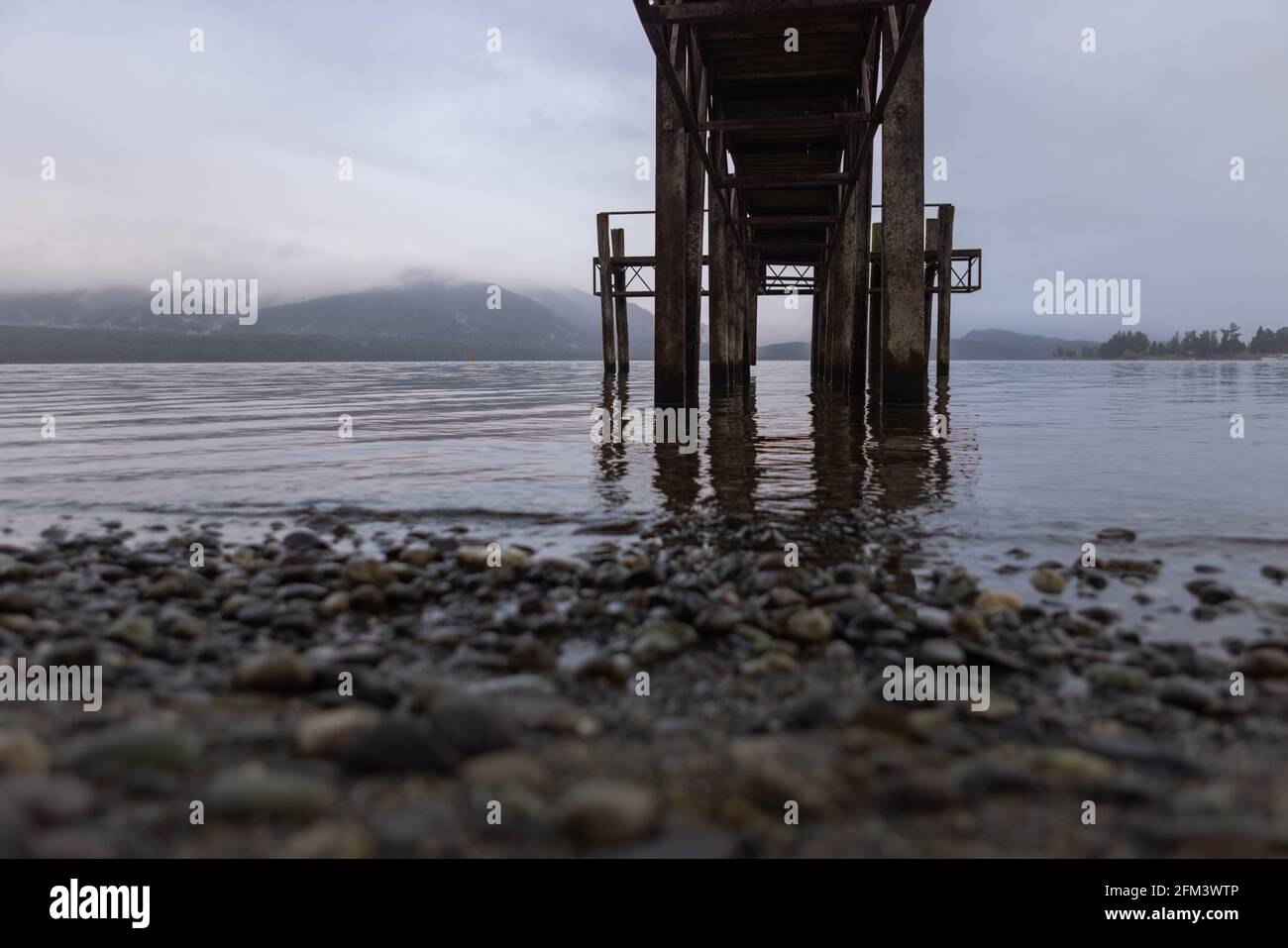 Under a Jetty on a Bleak Morning, Te Anau, South Island, New Zealand Stock Photo