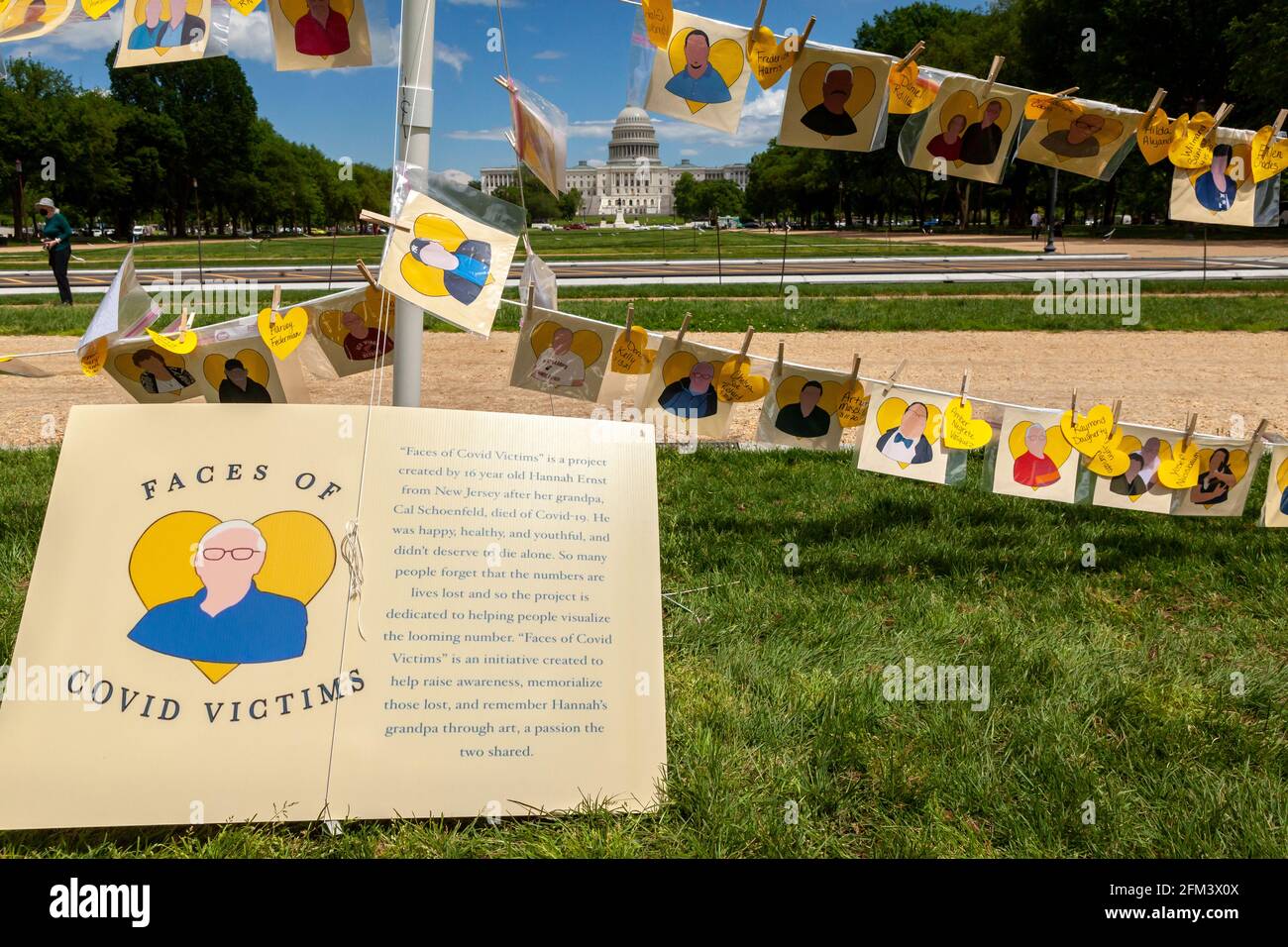 Washington, DC, USA, 5 May, 2021.  Pictured: The Faces of Covid memorial to those lost during the pandemic stands on the National Mall during a rally to pressure the United States Government to waive patent protections for the Covid-19 vaccine and make it easily accessible to the rest of the world.  14 organizations joined to host the rally, recognizing that worldwide immunity is in everyone’s best interest.  Credit: Allison C Bailey / Alamy Live News Stock Photo